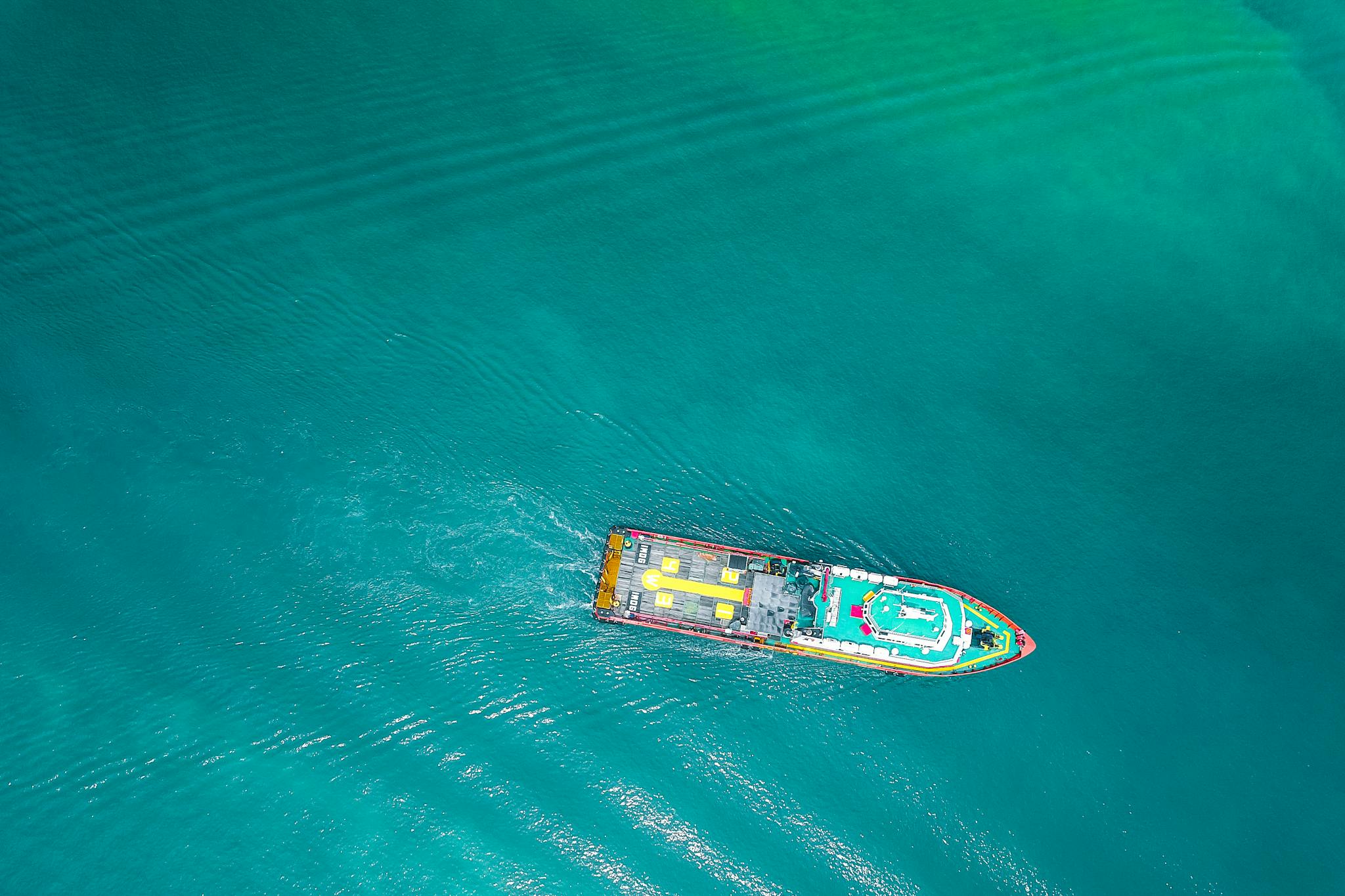 Powerful boat floating on azure seawater